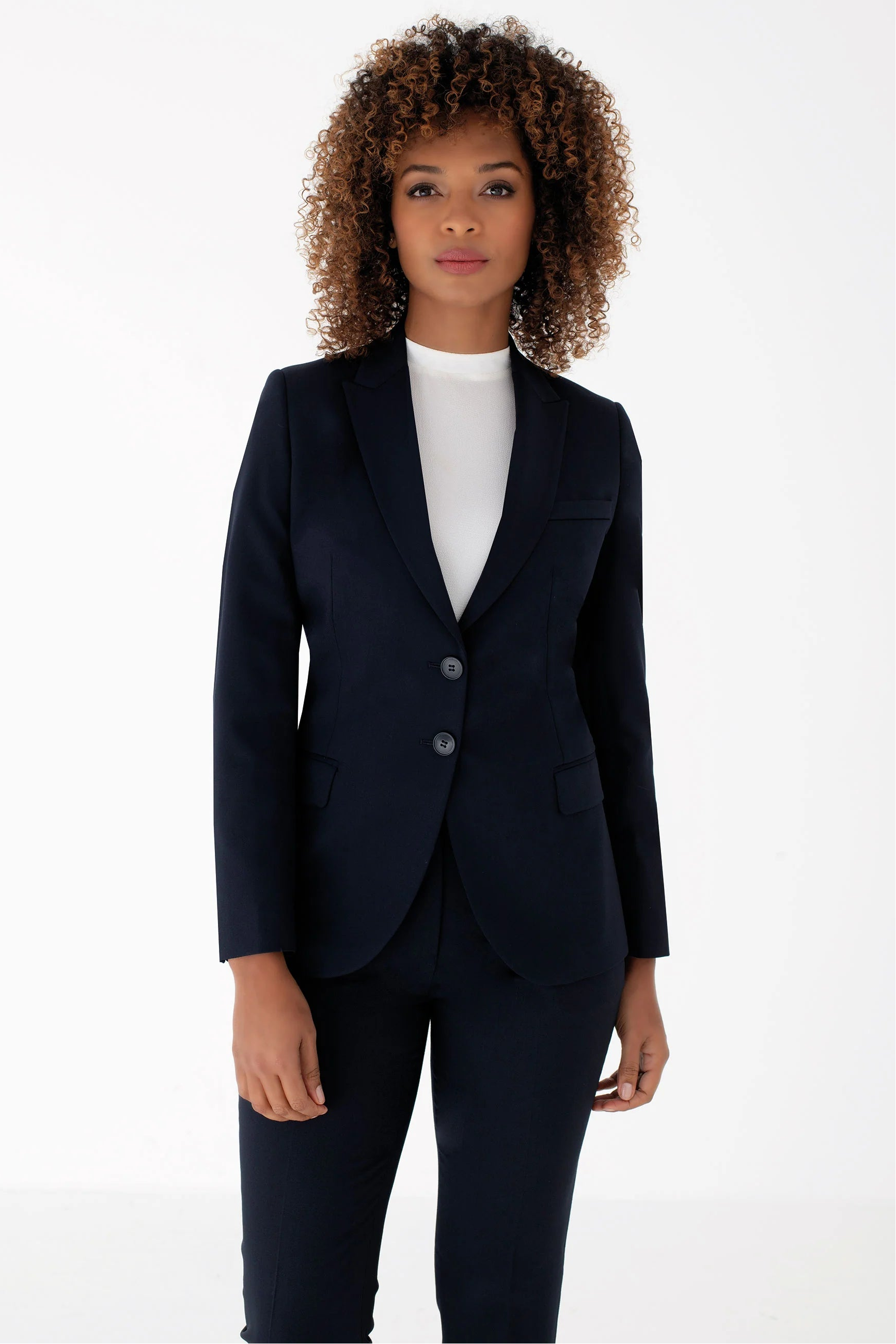 A woman wearing a suit
