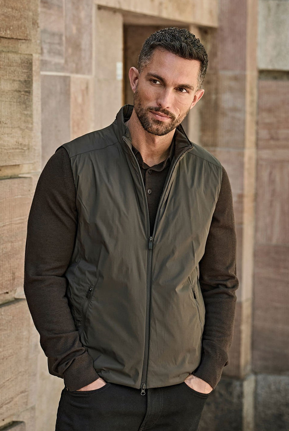 A Man Wearing a Tee Jays Bodywarmer as part of his work uniform