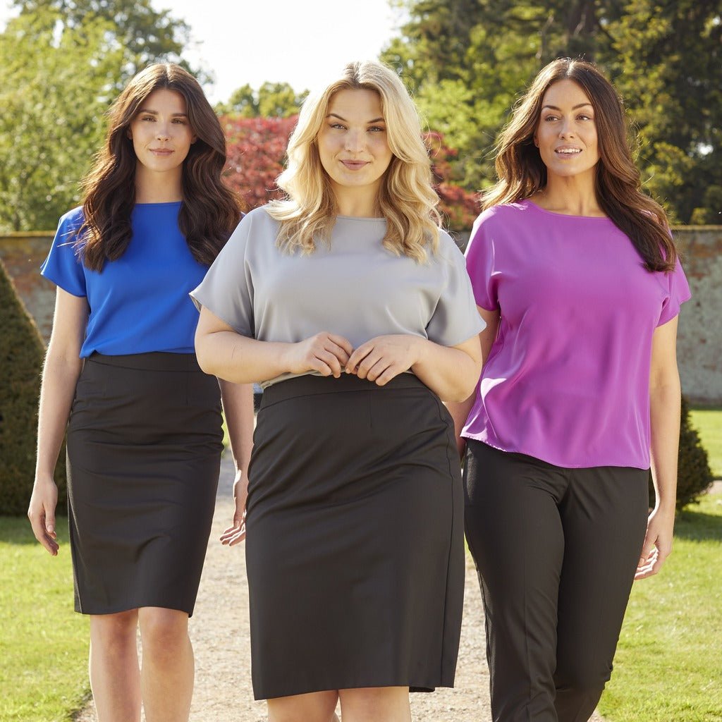 Simon Jersey Uniforms by - The Staff Uniform Company. The Image contains 3 ladies wearing Simon Jersey Blouses, One pink, One blue and one grey