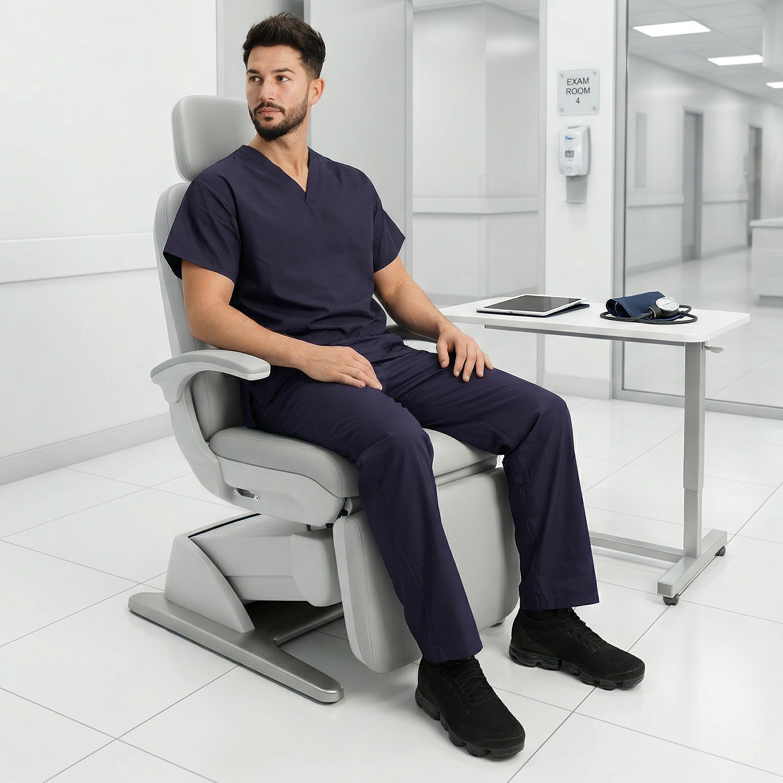 A man sat in a chair wearing healthcare trousers