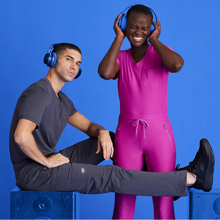 Two people wearing headphones on a blue background